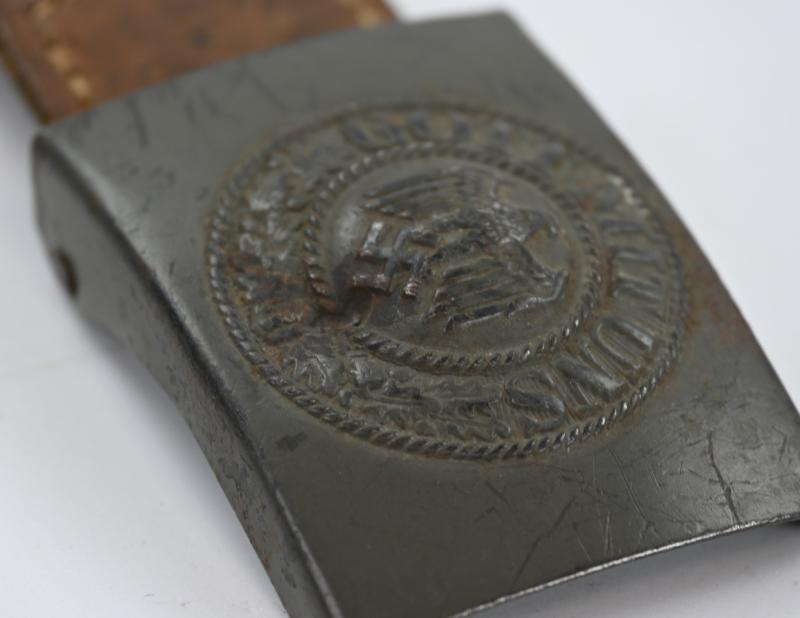 German WH Beltbuckle with Schrapnel damage and Tab 'E.Schneider'