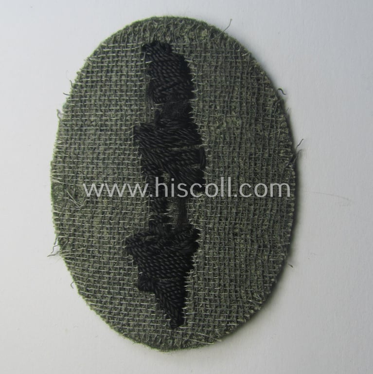 WH (Heeres) trade- and/or special-career-insignia (ie. hand-embroidered 'signal-blitz') example as executed in black-coloured linnen as was specifically intended for a soldier within the: 'Pionier-Trpn.'