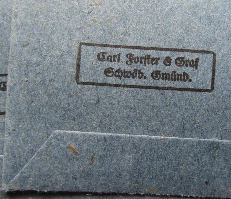 Neat, 'Zellstoff'-based medal-pouch, entitled: 'Eisernes Kreuz 2. Klasse 1939' being a darker-blue-coloured example as executed in typical: 'Zellstoff'-based paper, as was produced by the maker: 'Carl Forster & Graf'