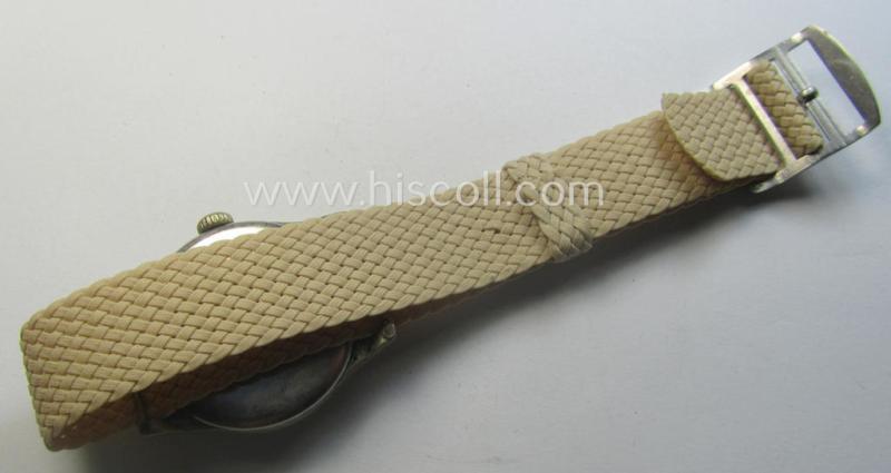 WH (Kriegsmarine) WWII-period wrist-watch (or: 'Dienstuhr') of the make: 'K.M. Siegerin' having a beige-white-coloured dial-plate and neatly engraved number on its back that reads: '120728'