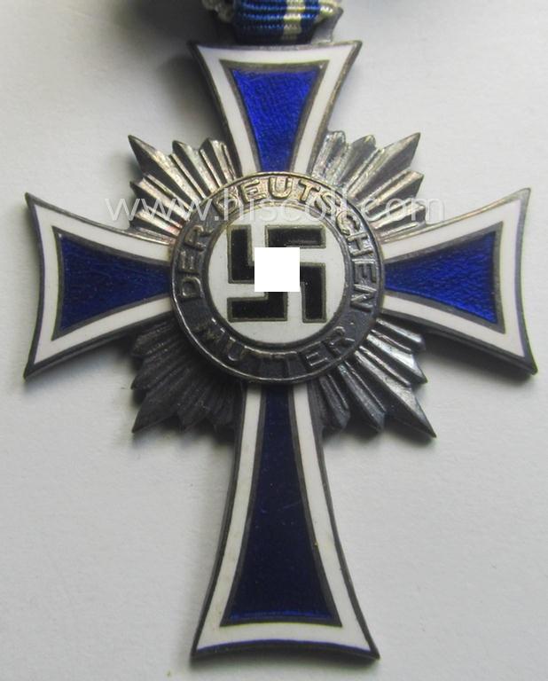 'Ehrenkreuz der deutschen Mutter - zweite Stufe' (or: silver-class mothers'-cross) that came mounted onto its long-sized ribbon and that came stored in its period pouch by the maker: 'E. Ferd. Wiedmann - Frankfurt a. M.'