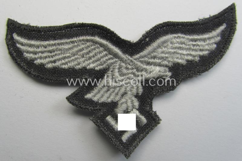 Superb, 'variant'-pattern WH (Luftwaffe) EM- (ie. eventually NCO-) type side-cap eagle (being a 'virtually mint- ie. unissued' example as executed in typical machine-embroidered-pattern onto an unusally seen 'thin-shaped'-background)
