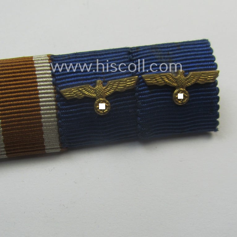 7-pieced, WH (Heeres etc.) medal-bar (ie. 'Feld- o. Bandspange') showing resp. the ribbons for an: 'EK II. Kl.', a: 'KvK II. Kl. mit Schwn.', an: 'Ost'-medal, a: Czech 'Anschluss'-medal, a: 'Westwall'-medal and two WH 'Dienstauszeichnungen'