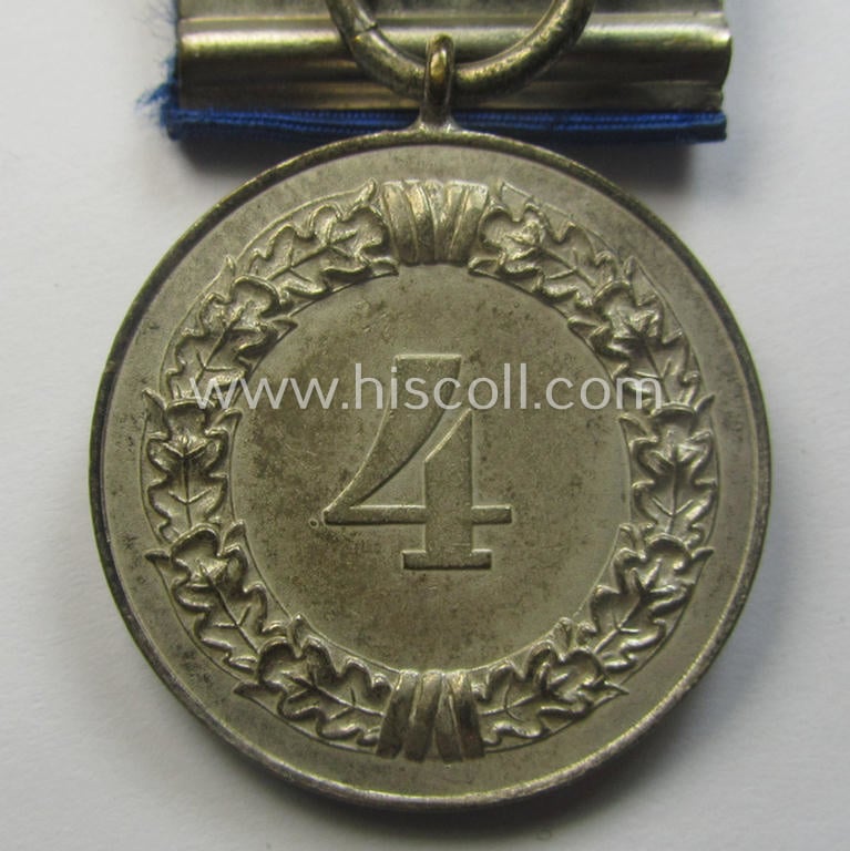 Silver-toned WH (Heeres o. KM) so-called: 'Einzelspange' showing a: 'WH-Dienstauszeichnung 4. Stufe' (as was intended for 4 years of loyal-service) and that shows a detailed, Heeres o. KM-type-eagle-device, period-attached
