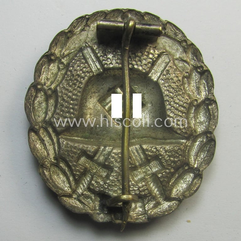 Luxuriously-styled, early-pattern silver-class wound-badge (ie.: 'Verwundeten Abzeichen in Silber') being a detailed so-called: 'Spanish Civil-War'-version that comes in a clearly used- and/or worn, condition