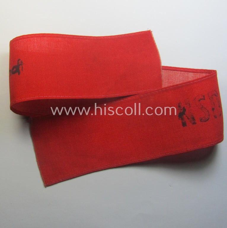 Unusually encountered - and most certainly scarcely seen! - thin-shaped, 'N.S.D.A.P.'-related armband (ie. 'Armbinde') being of the 'entirely printed'-type showing a swastika and text: 'NSDAP - Partei-Bereitschaft'