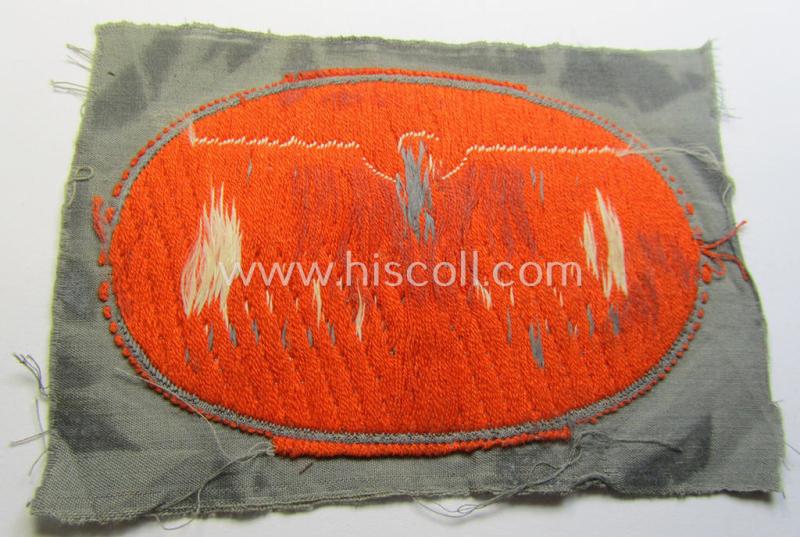 Superb, 'Post-Schutz' arm-badge (ie. arm-eagle) being a piece as executed in the 'BeVo'-weave-pattern - and showing a seldomly seen orange-coloured 'rim'! - and that comes in a 'virtually mint- ie. unissued', condition