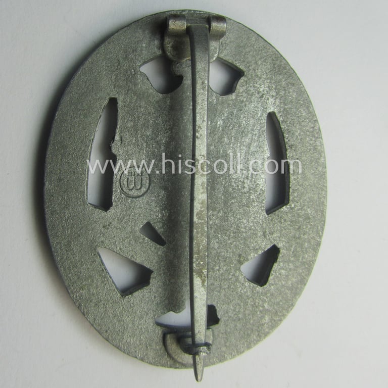 Superb, 'Allgemeines Sturmabzeichen' (or: general assault-badge ie. GAB) being a maker- (ie. 'ÜÜ'- ie. 'E.F. Wiedmann') marked so-called: 'Lily Pad-hinge'-example as was executed in zinc-based metal