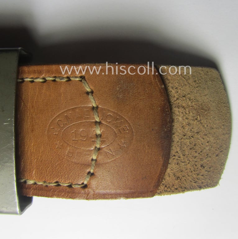 Superb, WH (Heeres) field-grey-coloured- and/or steel-based belt-buckle, being a maker- (ie. 'J. C. Maedicke'-) marked- and/or: '1941'-dated example on its leather-based tab and that comes in a wonderful almost mint-, condition