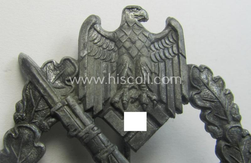 'Infanterie Sturmabzeichen in Silber' being a non-maker-marked and/or typical zinc- (ie. 'Feinzink'-) based version (ie. 'crimped scooped rifle-variant') as was (I deem) procuded by the: 'S&L'- (ie. 'Steinhauer u. Lück'-) company