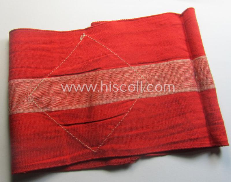 'Standard-issued'-pattern (ie. entirely woven) pattern, bright-red-coloured HJ- (ie. 'Hitlerjugend'-) related armband (ie. 'Armbinde') being a moderately worn- ie. used example that misses its 'RzM'-etiket