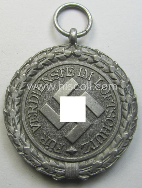 Neat, 'Luftschutz-Ehrenzeichen 2. Stufe' being a non-maker-marked example, as executed in (heavy) zinc-based metal (ie. 'Feinzink') and that came together with its period ribbon ie. 'Bandabschnitt'