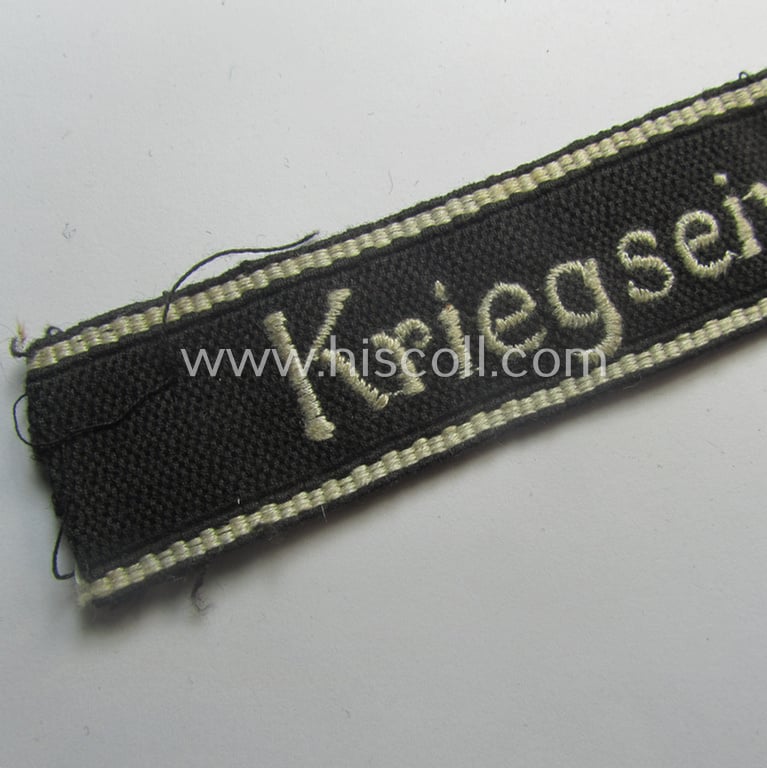 Superb - and actually never before encountered! - example of a HJ/BDM- ('Hitlerjugend' ie. 'Bund Deutscher Mädel'-) cuff-title (ie. 'Ärmelstreifen') entitled: 'Kriegseinsatzführer' being an example as executed in the machine-embroidered pattern
