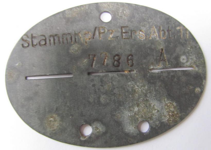 Unusual, zinc- (ie. 'Feinzink'-) based WH (Heeres) 'Panzer'-related- ID-disc, bearing the (neatly!) stamped unit-designation: 'Stamm.Kp./Pz.Ers.Abt. 11'
