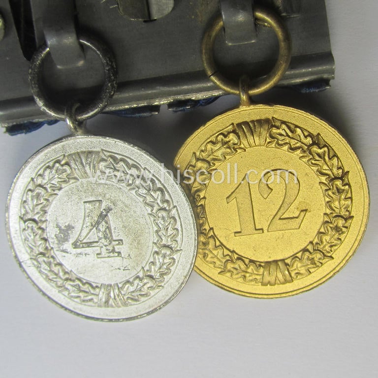 2-pieced medal-bar (ie. 'Spange') showing two: WH (Heeres o. Kriegsmarine) so-called: 'Dienstauszeichnungen für 4 u. 12 Jahre Treue Dienste' that both come period-mounted as a so-called: 'Doppelspange'