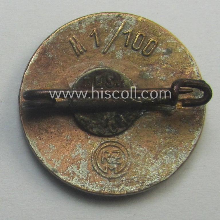 Neatly enamelled- (and bright-red-coloured!) 'N.S.D.A.P.'-membership-pin- ie. party-badge (or: 'Parteiabzeichen') which is nicely maker-marked on the back with the makers'-designation: 'RzM' and/or: 'M1/100' (= 'Werner Redo')