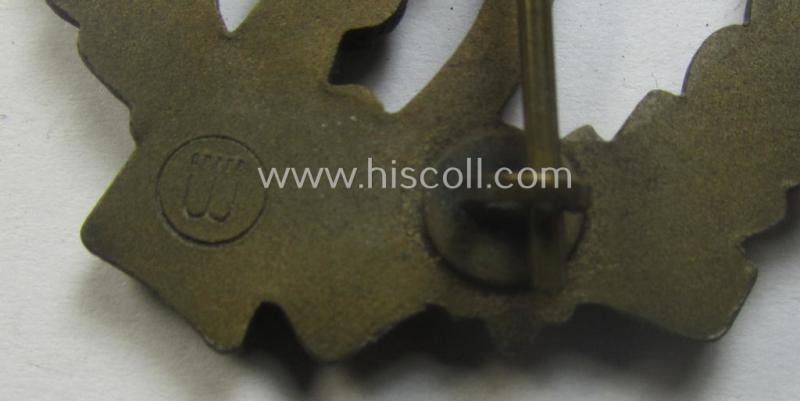 'Infanterie Sturmabzeichen in Bronze' (or: bronze-class infantry assault-badge ie. IAB) being a maker- (ie. 'ÜÜ'- ie. 'E.F. Wiedmann') marked so-called: 'Lily Pad-hinge'-example as was executed in zinc-based metal