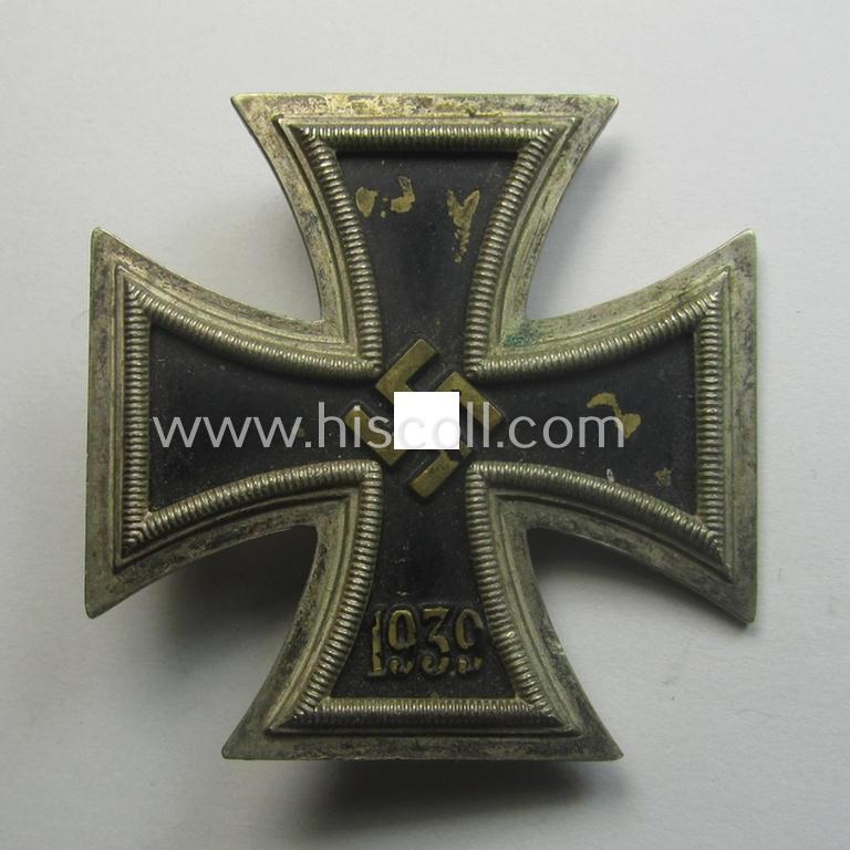 'Eisernes Kreuz 1. Kl.' (or: Iron Cross 1st class) being a typical maker- (ie. '15'-) marked example that as was produced by the Austrian maker (ie. 'Hersteller'): 'Friedrich Orth' and that comes as issued and worn