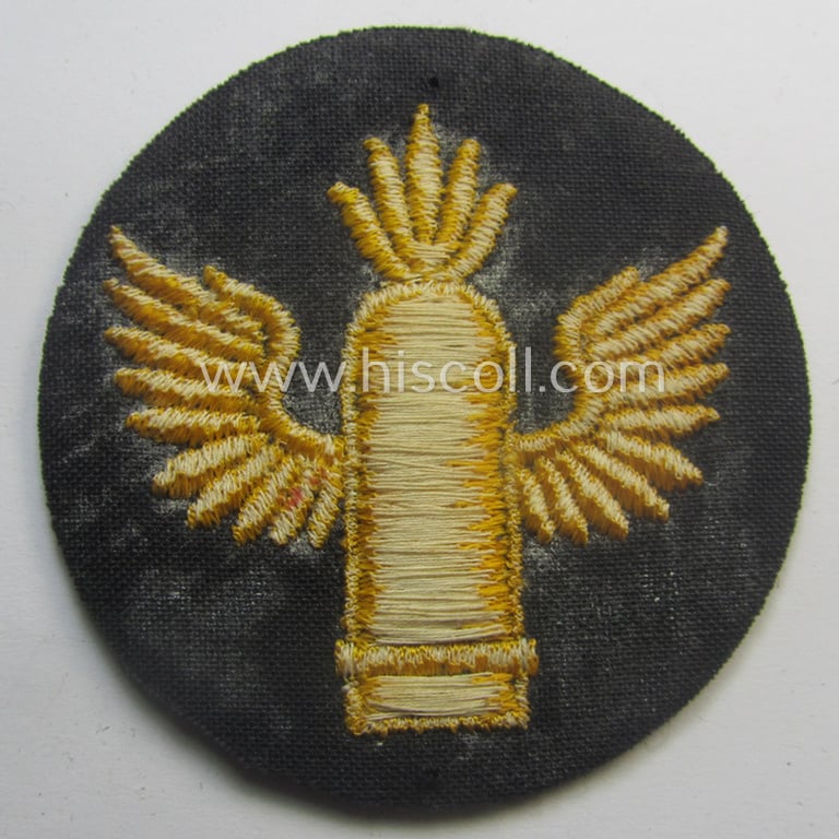 WH (Kriegsmarine) machine-embroidered career- ie. specialist-armbadge (ie. 'Tätigkeits-Abzeichen') as executed on bluish-toned wool as intended for usage by a: 'Küstenartillerie'-staff-member