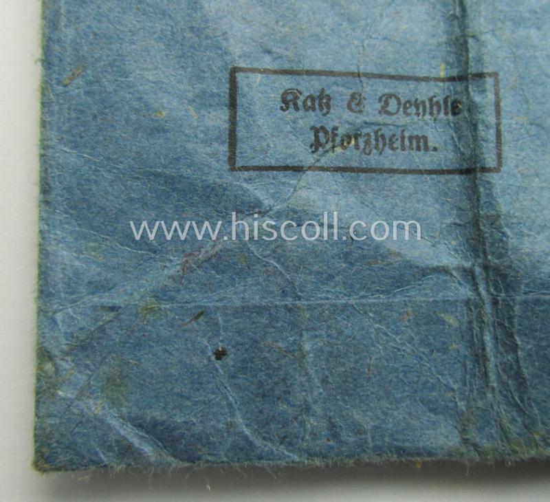 'Eisernes Kreuz II. Klasse' being a non-maker-marked example by the maker (ie. 'Hersteller'): 'Katz & Deyhle' that comes stored in its period (albeit incomplete), 'Zellstoff'-based pouch