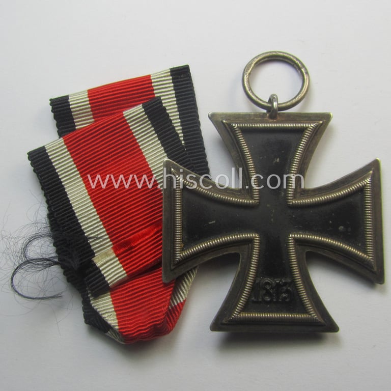 Scarcely seen, 'EK II. Klasse' being a maker- (ie. '123'-) marked example that comes with its original and once-mounted ribbon (ie. 'Bandabschnitt') as was produced by the desirable maker (ie. 'Hersteller'): 'Beck, Hassinger & Co.'