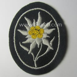 Waffen-SS-pattern, black-coloured sleeve-insignia (ie. 'Ärmelabzeichen') depicting an: 'Edelweiss'-flower...