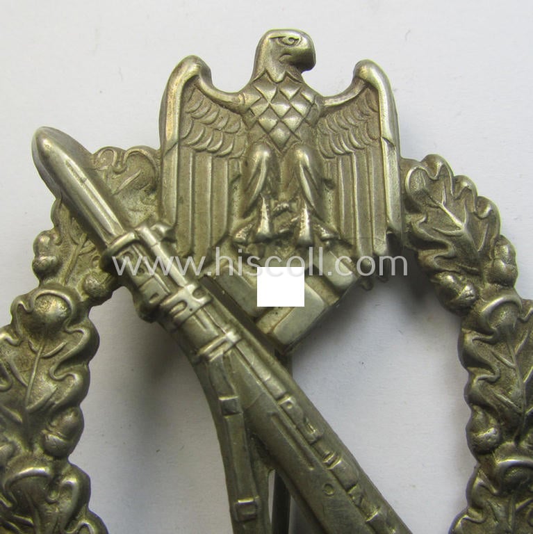 'Infanterie Sturmabzeichen in Silber' (or: silver-class infantry-assault-badge ie. IAB) being a 'Buntmetall'-based example by the: 'Otto Schickle'-company
