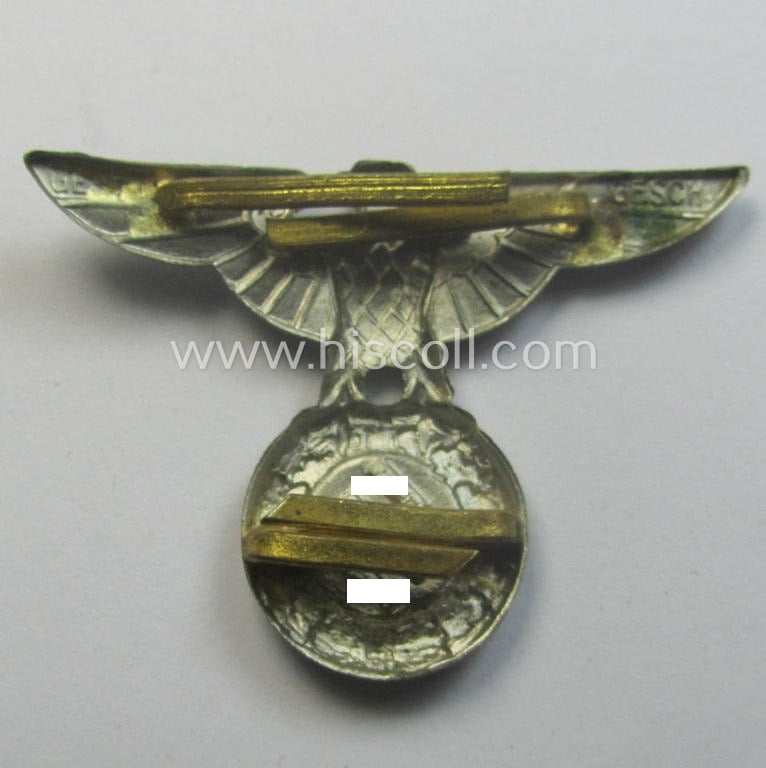 Silver-toned, early-pattern, SS- o. SA-type, political visor- (ie. 'Schirmmützen'-) cap- (ie. 'Kepi'-) eagle being a non-maker-marked example (that shows a: 'Ges.Gesch.'-patent-pending-designation) and that comes in a 'virtually mint'-, condition