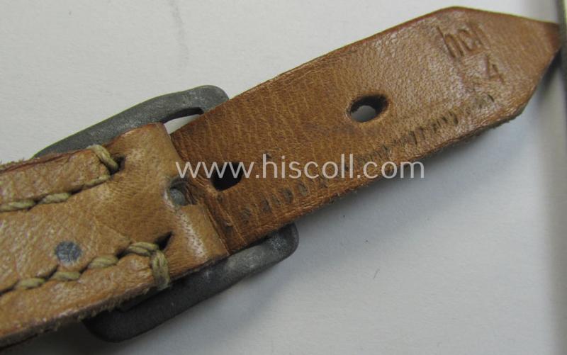 Later-war-period- and 'standard-issue'-pattern, black-coloured- and/or leather-based WH helmet-strap (ie. 'Riemen für Stahlhelm') being an: 'HCH 4'-marked example that comes in a never mounted ie. 'virtually mint' condition