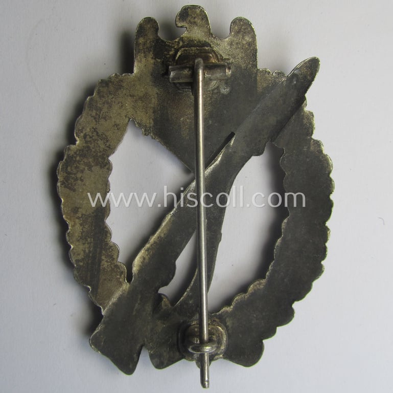 'Infanterie Sturmabzeichen in Silber' being a non-maker-marked and/or typical zinc- (ie. 'Feinzink'-) based version as was (I deem) procuded by the: 'Frank & Reif'-company