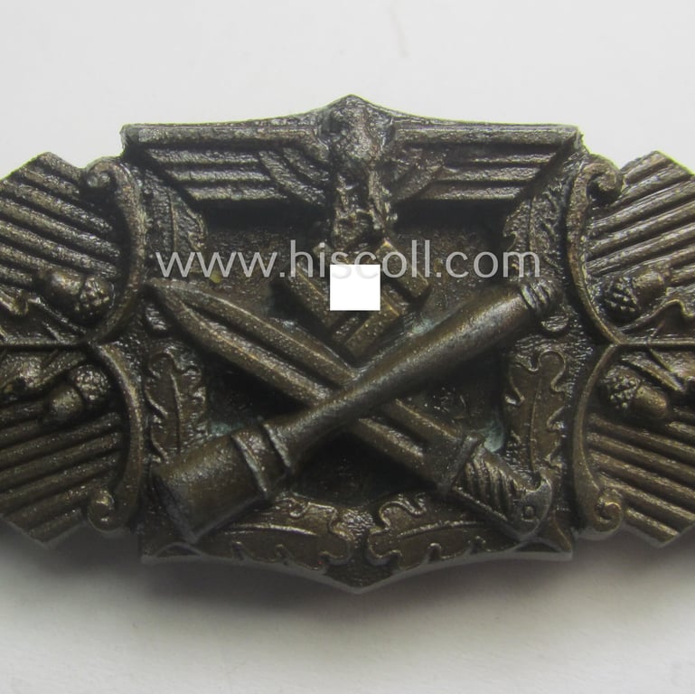 'Nahkampfspange in Bronze' (or: bronze-class close-combat clasp ie. CCC) being a (typical) non-maker-marked- and/or minimally converse-shaped specimen as was (I deem) produced by the maker- (ie. 'Hersteller') 'Steinhauer & Lück'