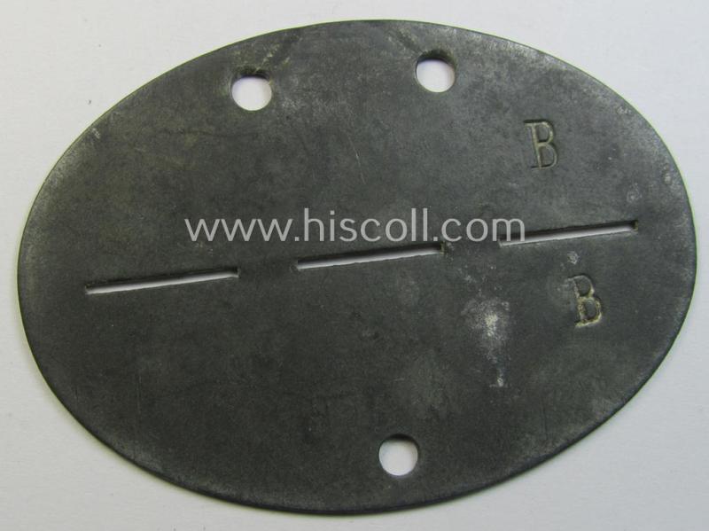Superb - and scarcely found! - typical zinc-based, WH (Heeres-) ie. 'Panzer'-related ID-disc (ie. 'Erkennungsmarke') bearing the clearly stamped unit-designation that reads: '1.Komp.Pz.Ers.Abt.1' and that comes as issued and/or worn