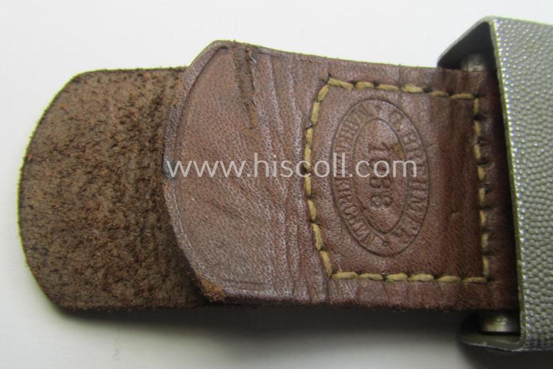 WH (Heeres) 'standard-issue'-pattern, field-grey-toned- and aluminium-based belt-buckle being a maker- (ie. 'G. Brehmer'-) marked- and/or: '1938'-dated example onto its leather-based tab