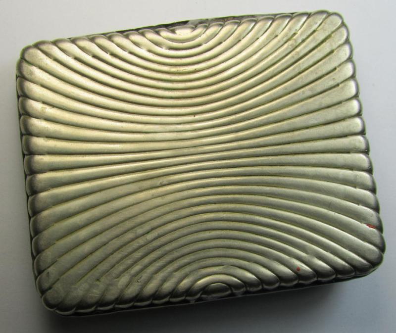 Unusal item that originated from a German soldier: a Russian, WWII-period, silver-toned tobacco-box showing a representation of Lenin coupled with some Cyrillic text (and that comes in a clearly used  condition)