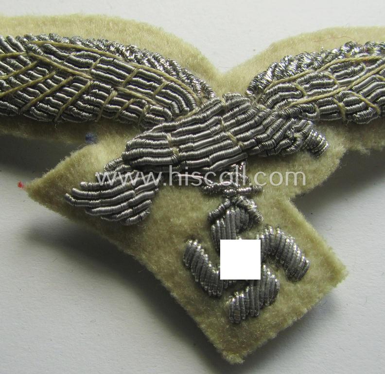 WH (Luftwaffe) officers'-type visor-cap eagle that is neatly hand-embroidered on beige-white-coloured wool as was specifically used for the white-topped LW officers'-type visor-caps (ie. 'Sommer-Schirmmützen')
