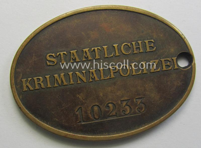 Stunning - and actually very rarely encountered! - copper-toned ID-disc (ie. 'Dienstmarke') entitled: 'Staatliche Kriminalpolizei' showing a pronounced eagle-device and bearing the unique, engraved serial- ie. bearers'-number that reads: '10233...