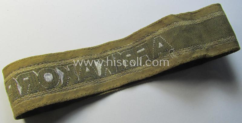 Superb, 'BeVo'-like cuff-title (ie. 'Ärmelstreifen') entitled: 'Afrikakorps' being a with certainty issued and truly worn example that comes in an overall nice- (ie. minimally shortened-, still sewn-together- and/or once tunic-attached-), condi...