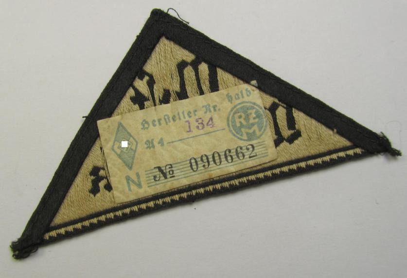 HJ/BDM ('Hitlerjugend' ie.: 'Bund Deutscher Mädel') district-triangle (ie. 'Gebietsdreieck') entitled: 'West Westmark' (being a 'virtually mint- ie. unissued' example that still retains its 'RzM'-etiket)