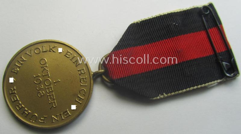 WH Czech-occupation- (ie. 'Anschluss'-) medal: '1. Oktober 1938' being a neat (albeit minimally tarnished) example that comes mounted onto its period ribbon and that shows a firmly (and period!) attached 'Prager Burg-Spange'