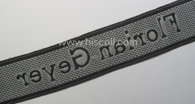 Waffen-SS, 1943-pattern cuff-title (ie. 'Ärmelstreifen') depicting the ('BeVo') machine-woven, Latin script text in silverish-grey linnen as was intended for a member of the: '8. SS-Kavallerie-Division “Florian Geyer”
