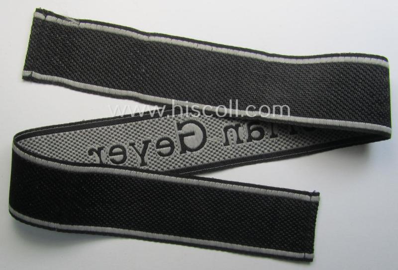 Waffen-SS, 1943-pattern cuff-title (ie. 'Ärmelstreifen') depicting the ('BeVo') machine-woven, Latin script text in silverish-grey linnen as was intended for a member of the: '8. SS-Kavallerie-Division “Florian Geyer”