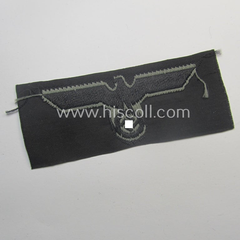 Mid-war-period, WH (Heeres) 'Panzer' cap-eagle & cocarde-set (ie. 'Schiffchenmützen-Adler u. Kokarde-Satz für Mannschaften u. Uffz.') being a 'virtually mint' set as executed in bluish-grey-coloured linnen onto a black-coloured background