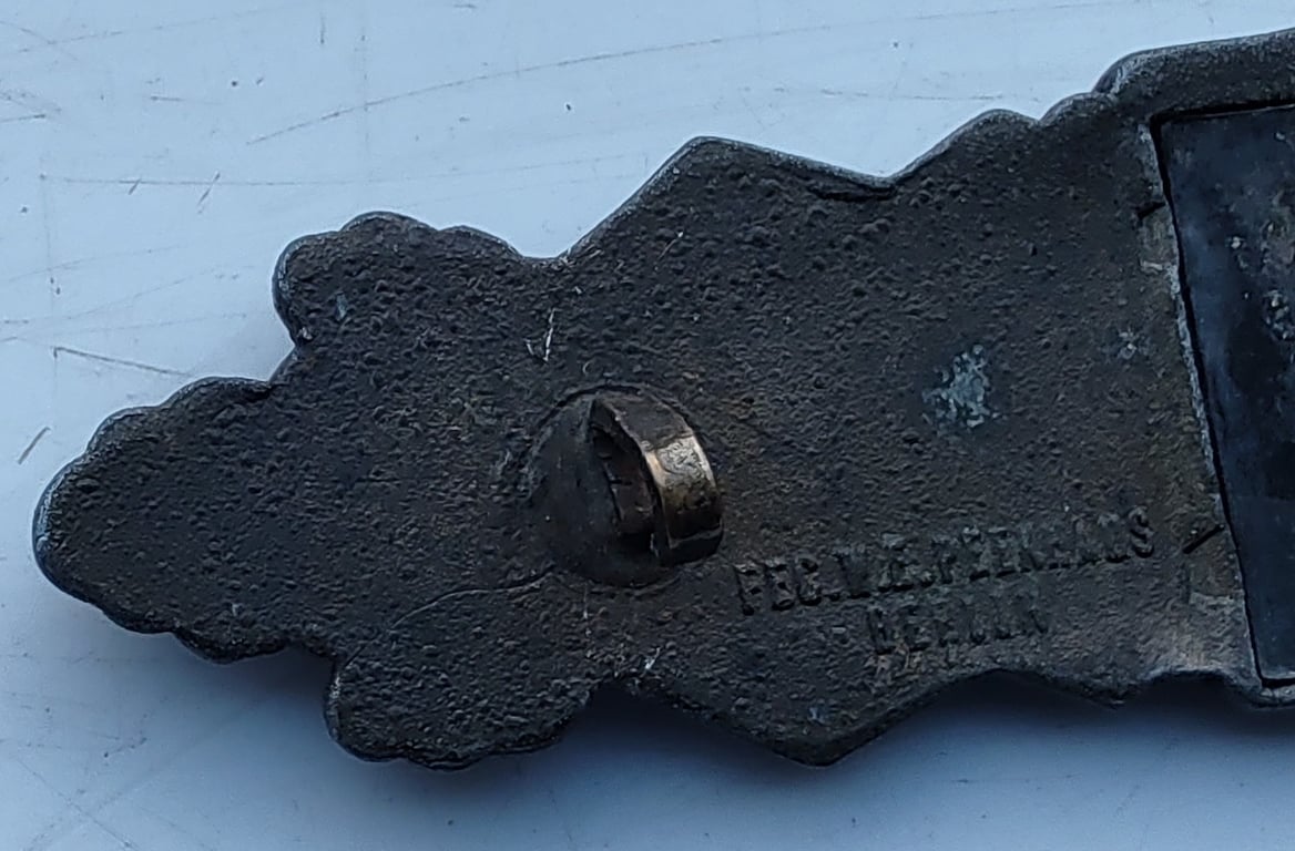 A  Nahkampfspange (Close Combat Clasp) in Bronze Grade, manufactured by C.E Juncker of Berlin