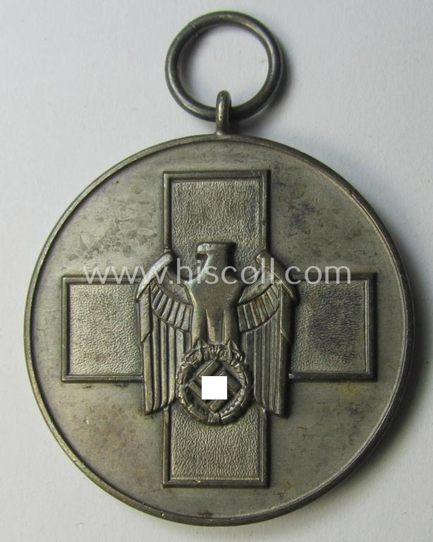 Attractive, silver-toned (and I deem zinc- ie. 'Feinzink'-based!) 'Deutsche Volkspflege'- (ie. civil-service) medal being a non-maker-marked example that came together with its (confectioned- and somewhat shortened) ribbon (ie. 'Bandabschnitt')