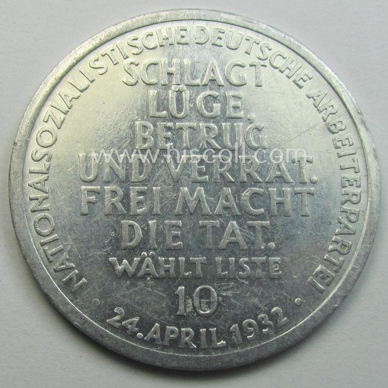 Unusual, N.S.D.A.P.-related token (ie. 'Erinnerungs- o. nichttragbare Medaille') showing an illustration of a man fighting a 3-headed snake and bearing the text: 'Schlagt Lüge, Betrug und Verrat. Frei macht die Tat - Wählt Liste 10 - 24. April 193...