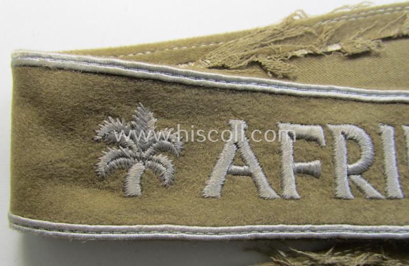 Attractive, WH (LW o. Heeres) cuff-title (ie. 'Ärmelstreifen') entitled: 'Afrika' (being an example that comes in a presumably issued- albeit simply never used- ie. 'virtually mint' condition)