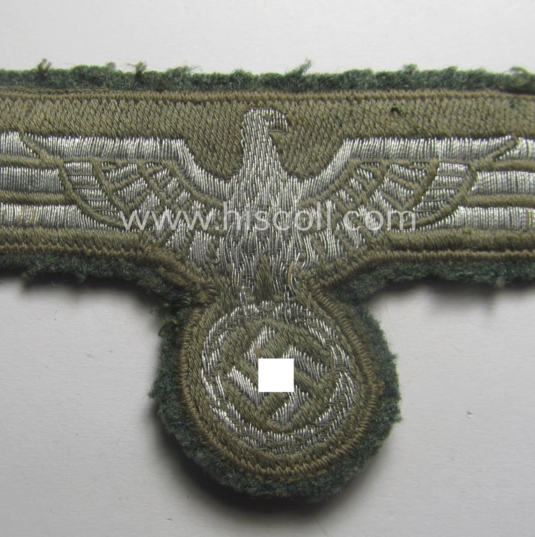 WH (Heeres) breast-eagle as executed in 'BeVo'-type-, so-called: 'flat-wire'-weave-pattern and pre-mounted on field-grey-coloured wool as was specifically intended for usage by soldiers (ie. NCOs) on their dress-tunics (ie. 'Waffenröcke')