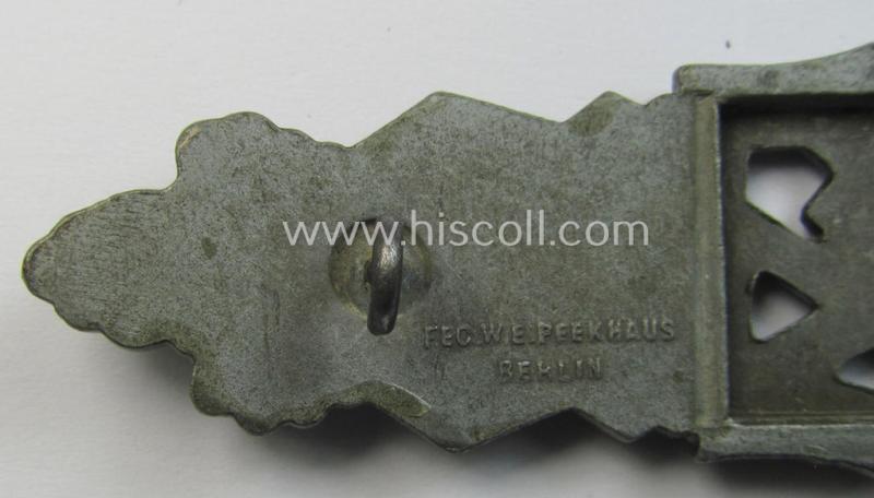 Attractive, 'Nahkampfspange in Bronze' (or: bronze-class close-combat clasp ie. CCC) being a maker- (ie. 'FLL'-) marked, so-called: '3rd pattern'-specimen as was produced by the maker- (ie. 'Hersteller') 'Friedrich Linden'