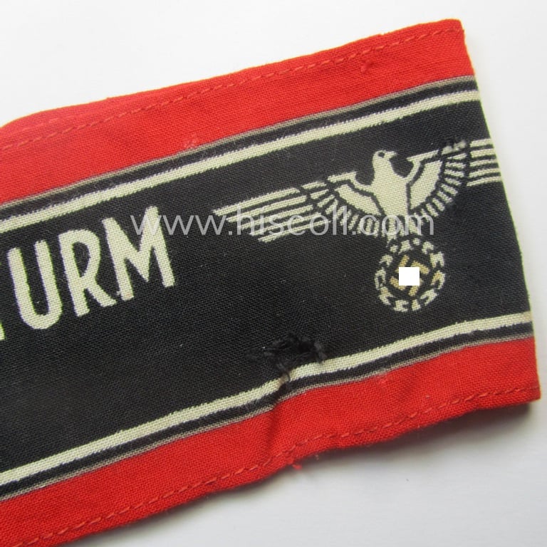 Moderately worn example of a (typically printed- and/or later-war-period) bright-red- and/or black-coloured so-called: 'Deutscher Volkssturm'-armband (ie. 'Armbinde') that comes in an overall nice condition