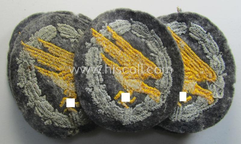 WH (Luftwaffe) 'Fallschirmschützen-Abzeichen in Stoff' (or: cloth-based paratroopers'-jump-badge) being nicely machine-embroidered specimen that come in a never used- ie. 'virtually mint-/unissued', condition